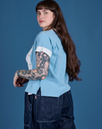 Angled back view of Painted Pantry Button-Up in Baby Blue on Sydney
