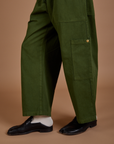 Drop Pocket Cargo Pants in Evergreen pant leg close up on Jerrod