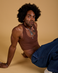 Jerrod is wearing Mini Tank in Fudgesicle Brown