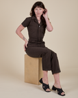 Alex is wearing Short Sleeve Jumpsuit in Espresso Brown