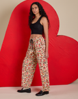 Side view of Hot Stuff Drop Pocket Cargo Pants and black Cropped Tank on Shahana