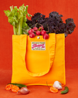Shopper Tote Bag in Sunshine Yellow with lettuce, celery and radishes in bag