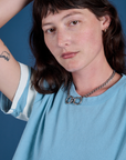 Painted Burly Tee in Baby Blue close up on Alex