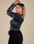 Long Sleeve Baby Tee in Black Magic Waters side view on Tiara