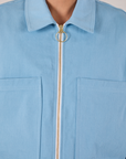 Mechanic Jacket in Baby Blue close up of brass zipper