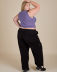 Back view of Muscle Tee in Faded Grape and black Drop Pocket Cargo Pants on Juliet
