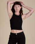 Alex is 5’8” and wearing P Racerback Tank in Black