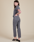 Angled back view of Short Sleeve Jumpsuit in Washed Grey on Alex