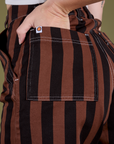 Close up of Alex's hand in the back pocket of Longline Work Shorts in Fudgesicle Brown