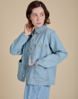 Angled front view of Indigo Denim Work Jacket in Light Wash on Hana