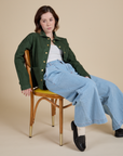 Hana is wearing Denim Work Jacket in Swamp Green