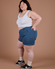 Ashley is 5’7” and wearing 1XL Classic Work Shorts in French Blue paired with a Cropped Tank in Vintage Tee White