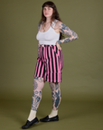 Angled front view of Longline Work Shorts in Bubblegum Pink and vintage tee white Cropped Tank
