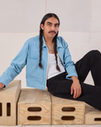 Anthony is wearing Mechanic Jacket in Baby Blue