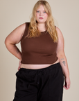 Juliet is 5'7" and wearing L Muscle Tee in Fudgesicle Brown