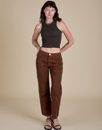 Alex is wearing Racerback Tank in Espresso Brown and fudgesicle brown Work Pants