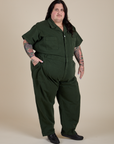 Angled front view of Short Sleeve Jumpsuit in Swamp Green on Sam