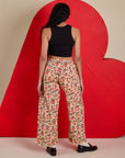 Back view of Hot Stuff Drop Pocket Cargo Pants and black Cropped Tank on Shahana