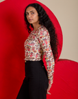 Side view of Long Sleeve Baby Tee in Hot Stuff Print on Shahana