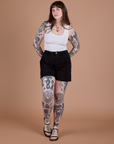Sydney is wearing Classic Work Shorts in Basic Black and Cropped Tank in Vintage Tee White