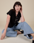 Pantry Button-Up in Basic Black and light wash Indigo Wide Leg Trousers on Alex