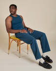 Isaac is wearing Racerback Tank in Lagoon and matching Work Pants