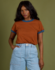 Kandia is wearing Vintage Ringer Tee in Burnt Terracotta tucked into light wash Carpenter Shorts