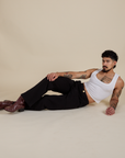 Jesse is wearing Work Pants in Basic Black and Cropped Tank in Vintage Tee White