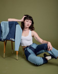 Alex is wearing Mismatched Denim Carpenter Jeans and Cropped Tank in Vintage Tee White
