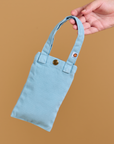 Cell Phone Tote in baby blue held by model