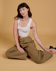 Baggy Mid-Rise Trousers in Desert Brown and vintage tee white Cropped Tank on Alex