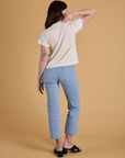 Back view of Organic Vintage Tee in Vintage Off White and light wash Carpenter Jeans on Alex