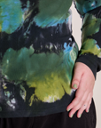 Long Sleeve Baby Tee in Green Pool bottom close up on Juliet