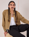 Anthony is wearing Mechanic Jacket in Desert Brown