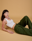Baggy Mid-Rise Trousers in Evergreen and vintage tee white Cropped Tank on Alex