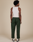 Back view of Heavyweight Trousers in Swamp Green and Tank Top in Vintage Tee Off-White on Jerrod