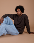 Jerrod is wearing Long Sleeve Burly Tee in Espresso Brown