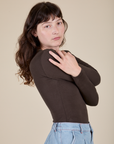 Long Sleeve Baby Tee in Espresso Brown side view on Alex