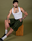 Jesse is wearing Longline Work Shorts in Evergreen and vintage tee white Cropped Tank