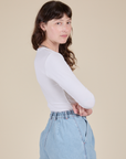 Side view of Long Sleeve Baby Tee in Vintage Tee Off-White on Alex
