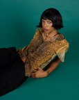 Kira wearing the Leopard Pantry Button Up