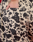 Close up of Juliet's hand in the back pocket of the Cow Drop Pocket Pant