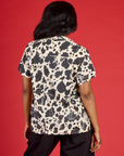 Back view of Kandia wearing the Cow Pantry Button Up