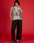 Kira wearing the Cow Pantry Button Up with the Black Drop Pocket Pants