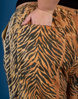 Close up of Juliet's hand in the back pocket of the Tiger Drop Pocket Pant