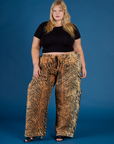 Juliet is 5'7" and wearing 2XL Tiger Drop Pocket Pant with the Black Cropped Baby Tee