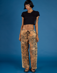 Kira is wearing the Tiger Drop Pocket Pant with the Black cropped Baby Tee