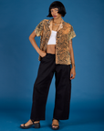 Kira is 5'10" and wearing the Tiger Pantry Button Up
