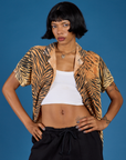 Kira is wearing the Tiger Pantry Button Up open with the Vintage Tee White Cropped Tank underneath