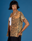 Close up side angled of Kira wearing the Tiger Pantry Button Up